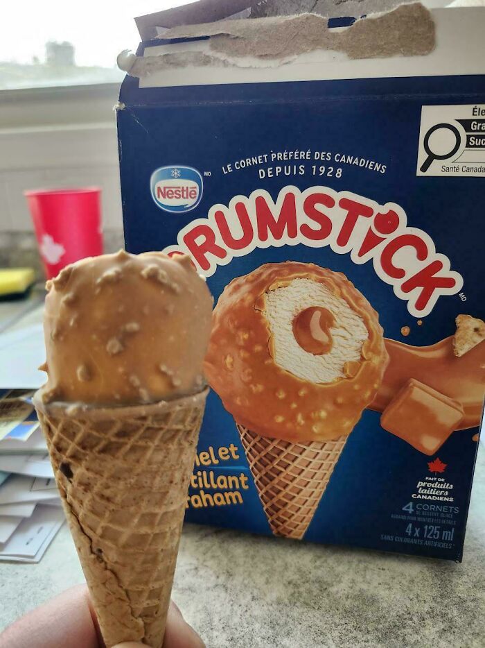 A Rumstick ice cream cone that looks much smaller than advertised on the box, illustrating products getting worse while getting more expensive.