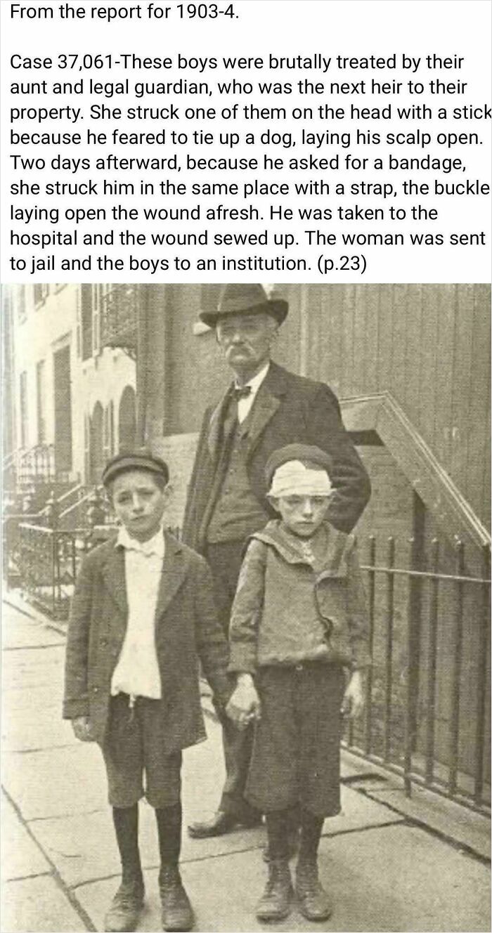 Two young boys, one with a head bandage, stand with an older man in a poignant historical photo.