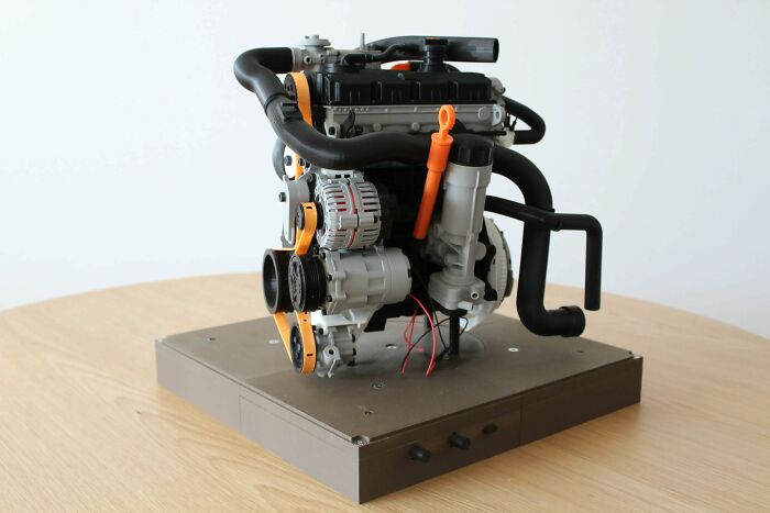 A detailed 3D printed model of a car engine, an intricate item people needed and printed with their 3D printers for display or study.