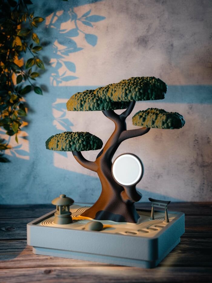 A meticulously 3D printed miniature Japanese zen garden with a bonsai tree and a moon-like light.