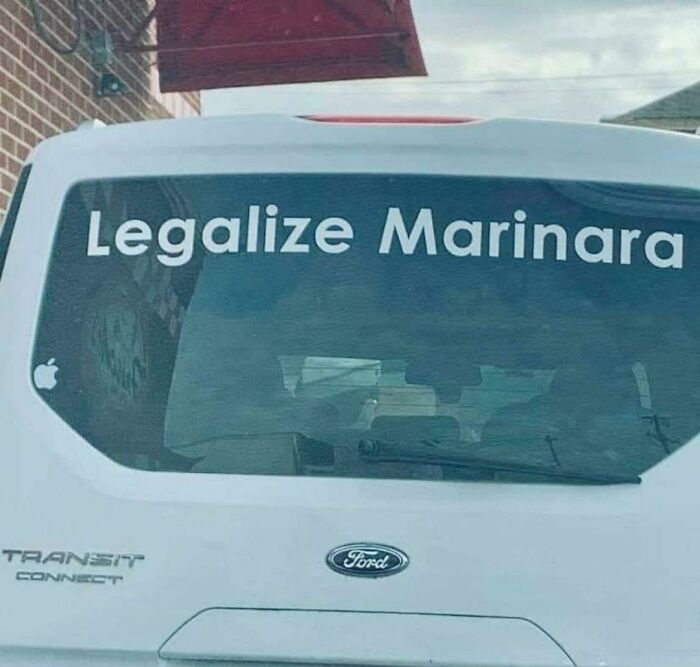 A chaotic sign spotted in the wild on a car window reading: Legalize Marinara.
