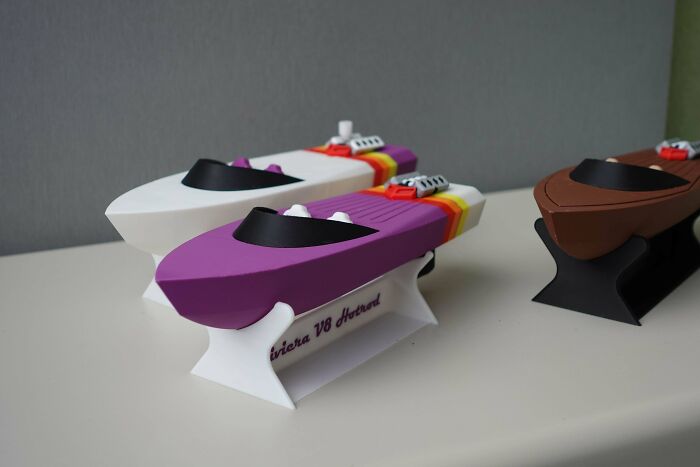 Collection of colorful model speedboats, demonstrating creations from 3D printers.