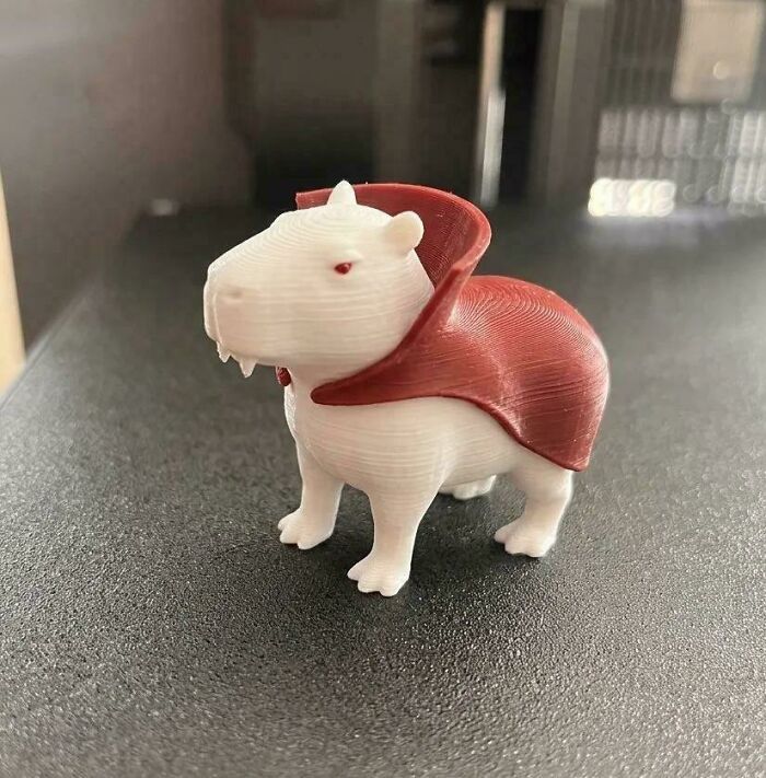A small 3D printed capybara figurine dressed as a vampire, an example of things people printed with 3D printers.