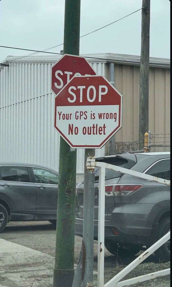 A chaotic stop sign spotted in the wild reading: Your GPS is wrong, no outlet.