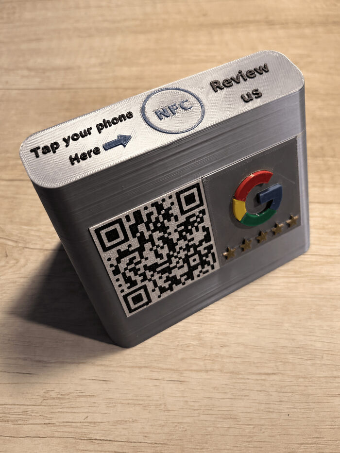 A 3D printed NFC and QR code review stand for Google reviews, demonstrating how people printed them with 3D printers.