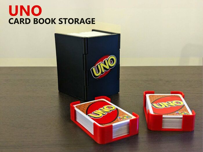 Custom 3D printed UNO card book storage and two cardholders for gameplay.