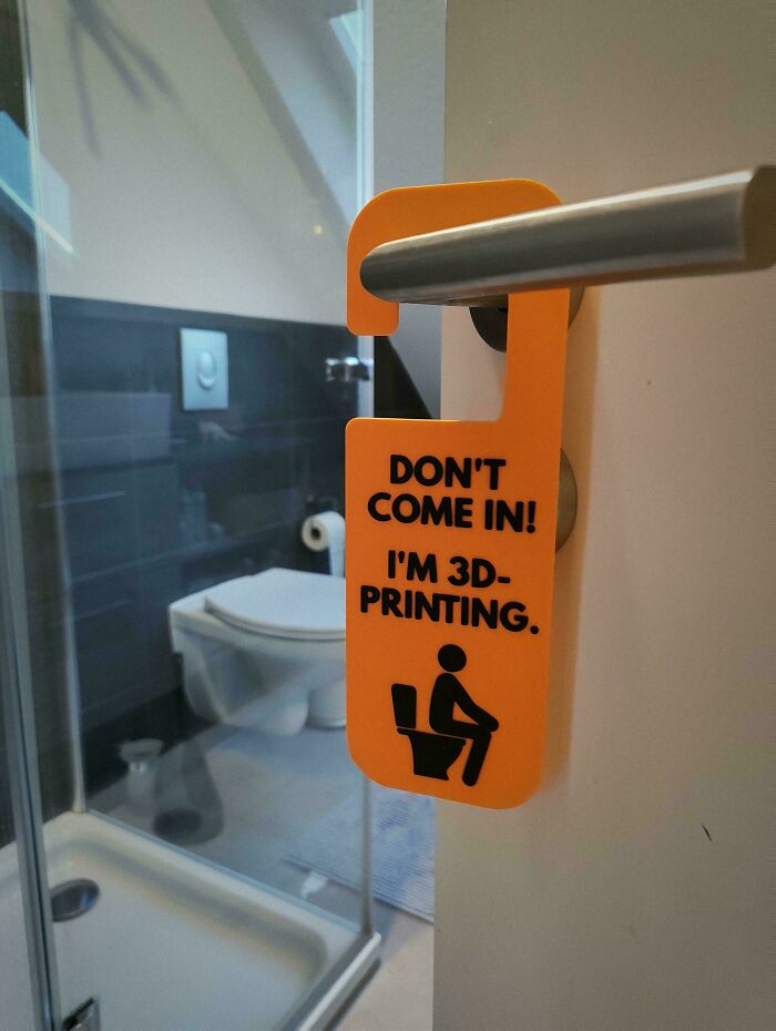 A humorous door hanger with a 3D-printing theme, showcasing funny items people printed with 3D printers.