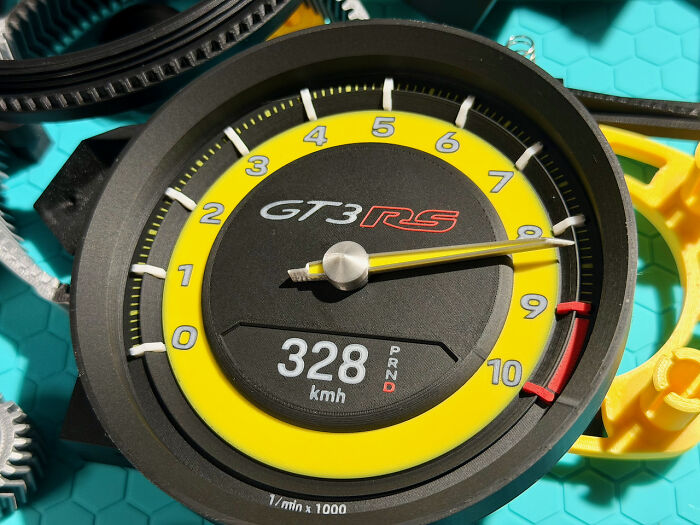 A meticulously crafted GT3RS speedometer, a cool car part people printed with 3D printers.