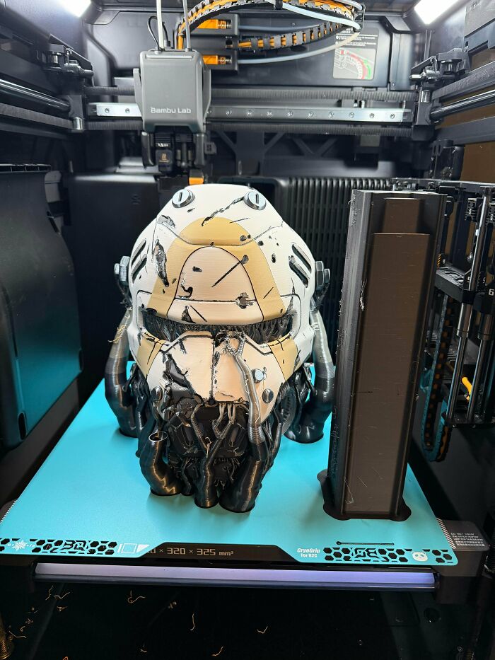 An intricate, large 3D printed sci-fi helmet with a weathered look, showing the detailed objects people printed using 3D printers.