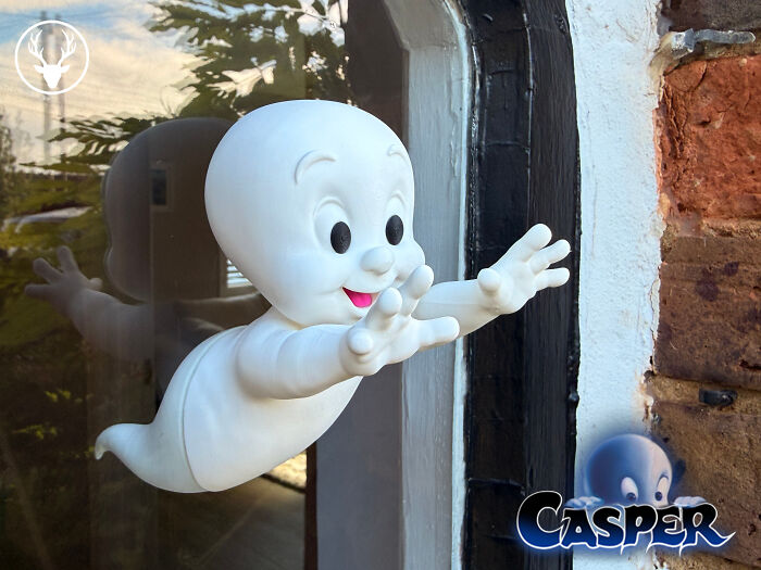 A delightful 3D printed Casper the Friendly Ghost figure seemingly floating out of a window, an example of what people printed.