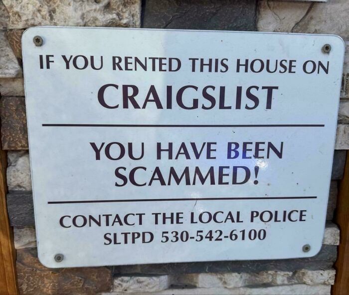 A chaotic sign in the wild warning that a Craigslist house rental is a scam, making people question reality.