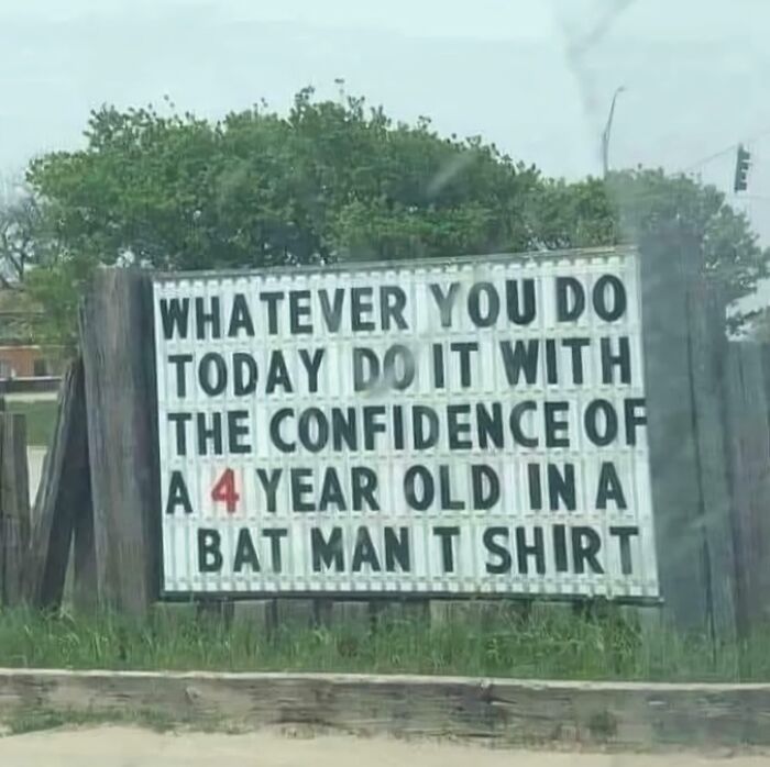 An inspiring chaotic sign spotted in the wild: Do it with the confidence of a 4-year-old in a Batman t-shirt.