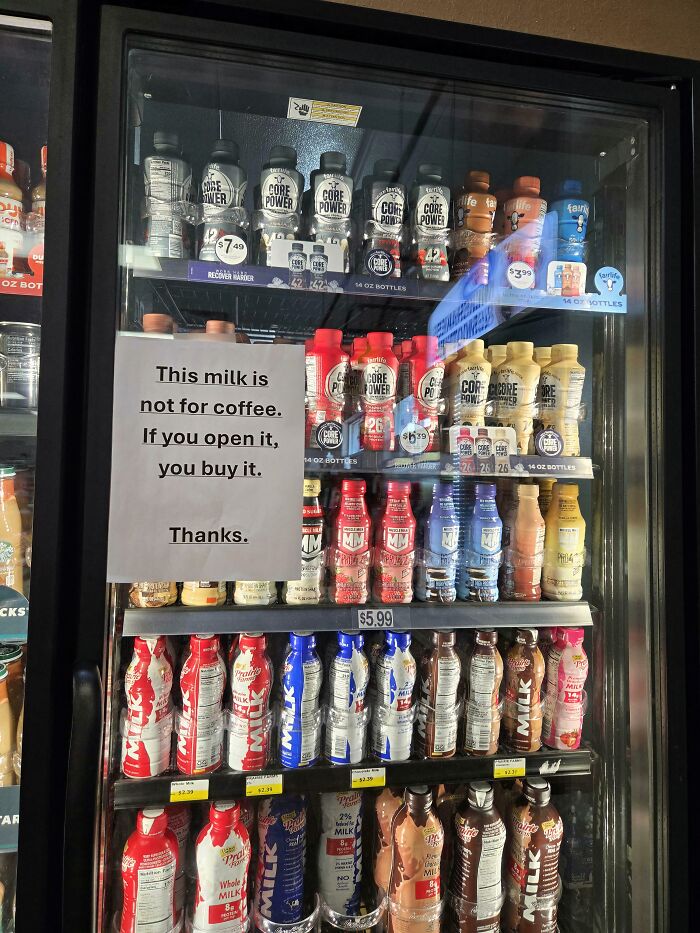 A chaotic sign spotted in the wild on a refrigerator door: This milk is not for coffee. If you open it, you buy it.