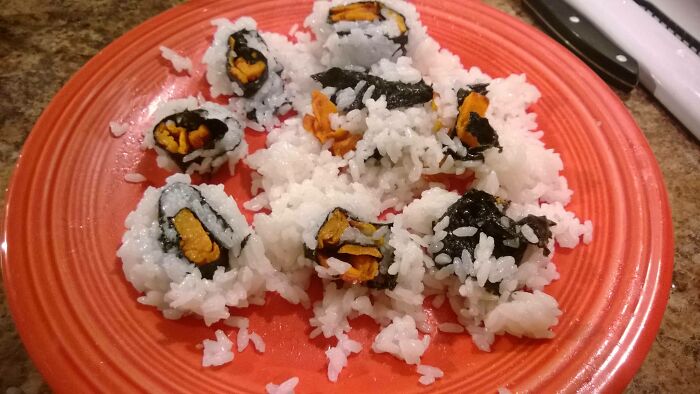 A plate of messy, deconstructed sushi rolls, a clear example of DIY fails in cooking.