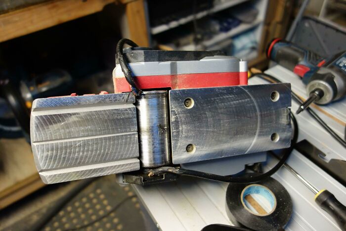 A DIY fail of an incorrectly assembled woodworking tool with visible s***w marks.
