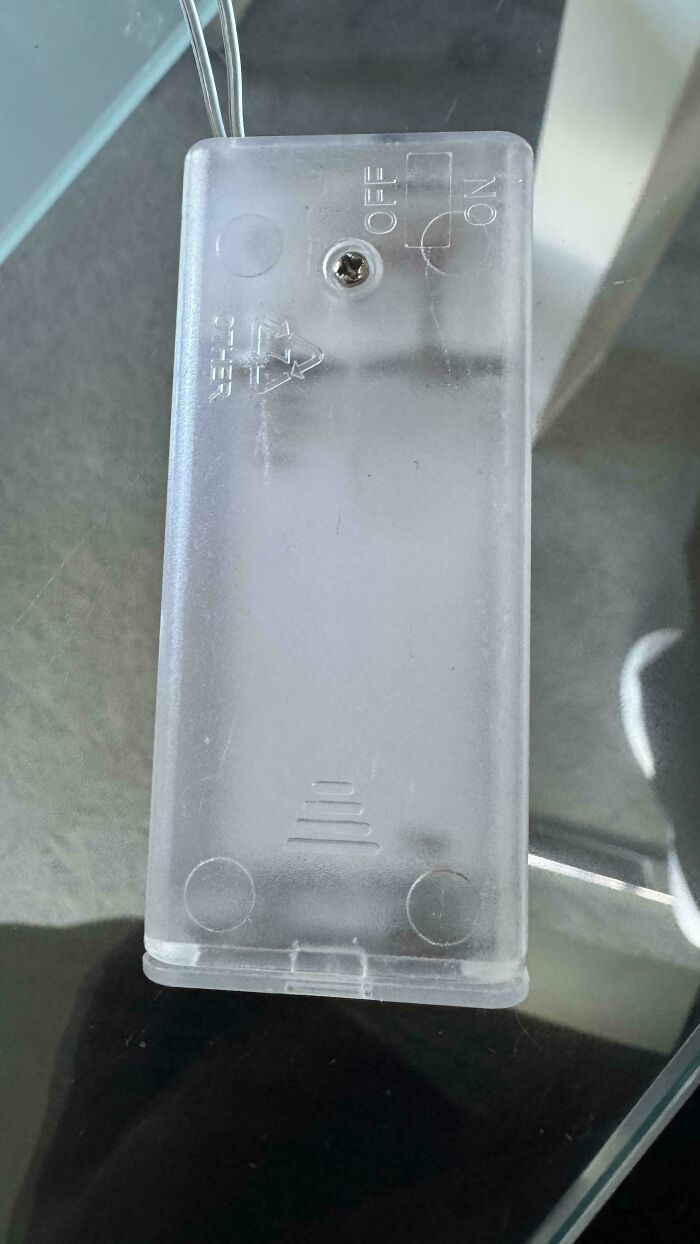 A translucent plastic battery pack with a tiny s***w and an OFF/ON switch, a clear example of DIY fails.