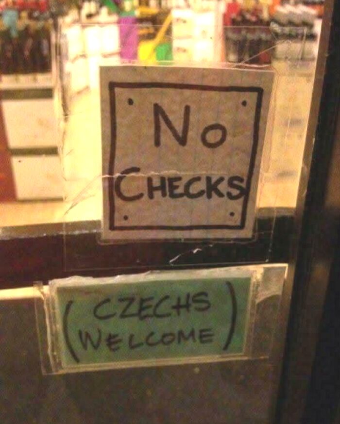 Chaotic signs spotted in the wild: one says No Checks, another below it says Czechs Welcome.