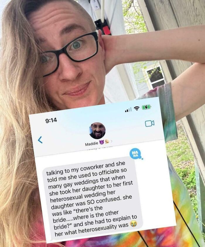 A woman holds her phone, displaying a text message about embarrassing lies from someone who spotted them on the internet.