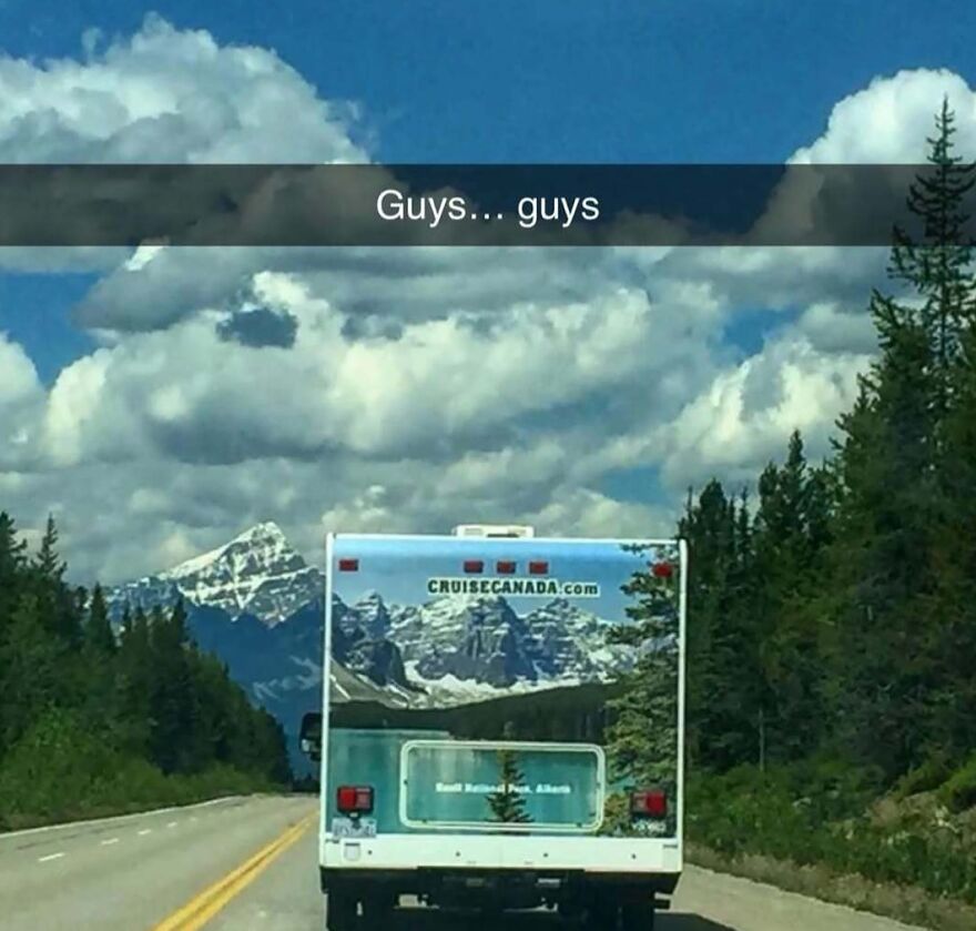 A chaotic scene of an RV on a road with mountains, making you doubt your sanity.