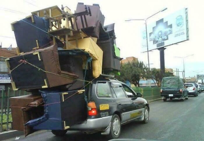 Car overloaded with large furniture pieces in moving fails pics