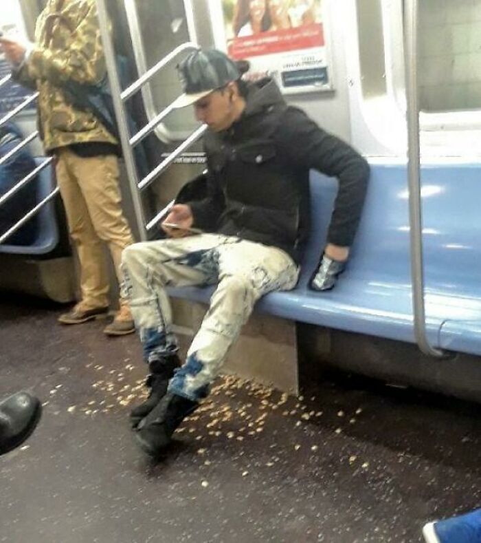 A passenger eating seeds on public transport leaving a mess