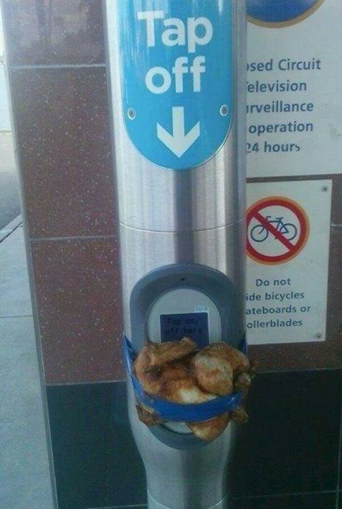 A roast chicken strapped to a public transport card reader