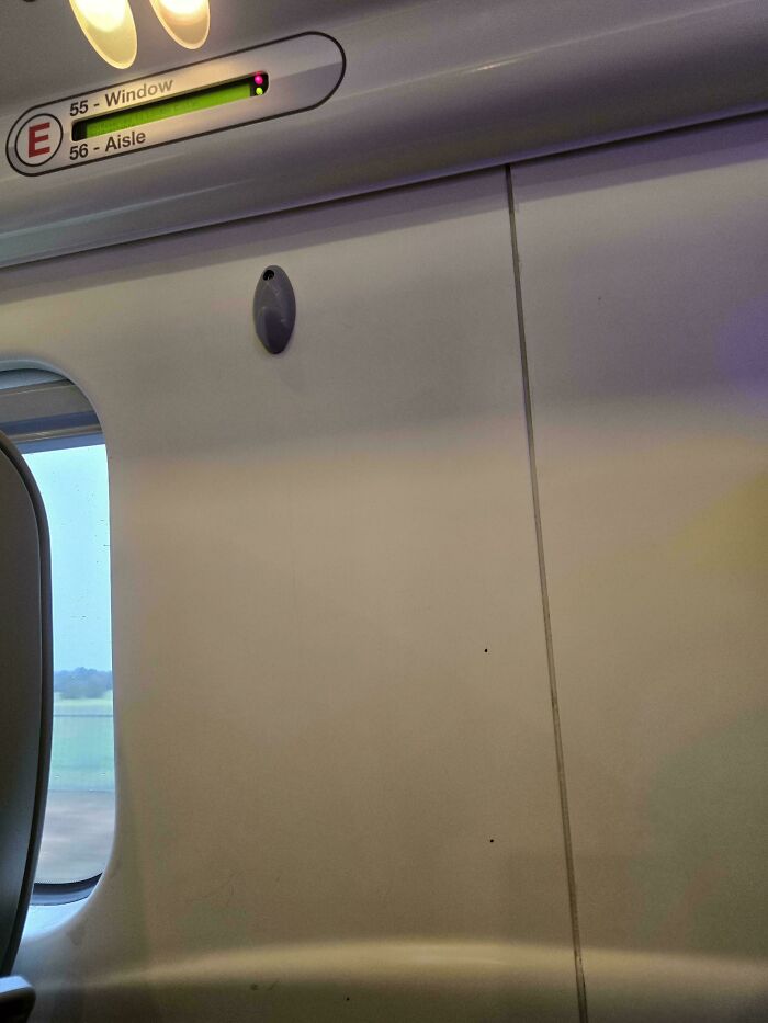 Train seat row without a window, illustrating awkward public transport interactions.