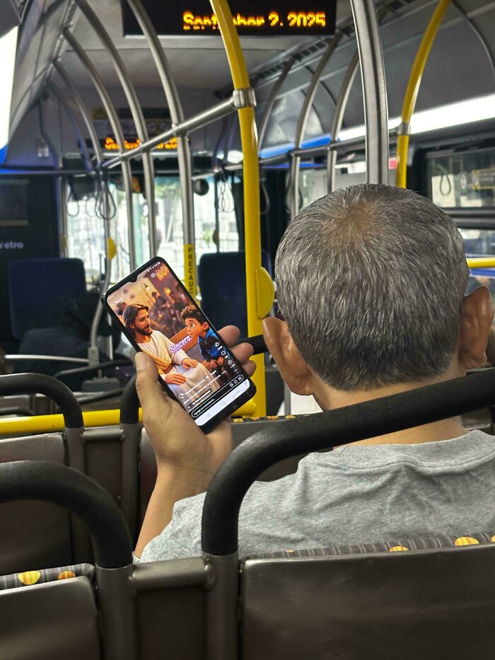A man watching a video of Jesus on his phone, showing odd public transport interactions.