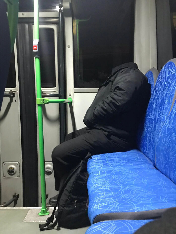 An optical illusion of a headless passenger during unusual public transport interactions on a city bus.