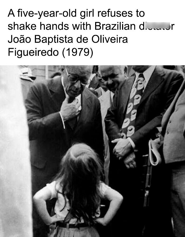 A little girl refusing to shake hands with a dictator in an old photo.