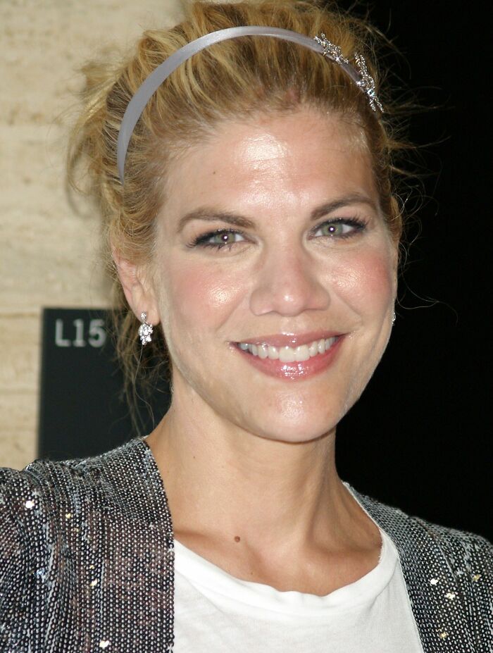 A close-up portrait of actress Kristen Johnston smiling at an event.