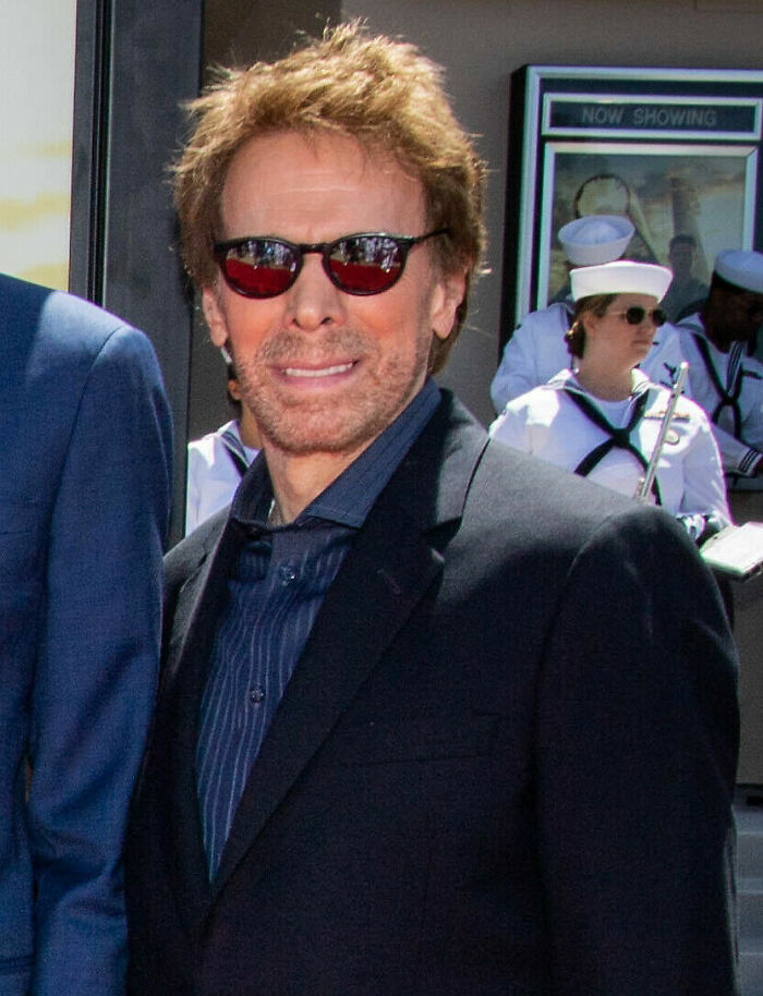 Producer Jerry Bruckheimer wearing sunglasses and a black suit jacket at an outdoor event