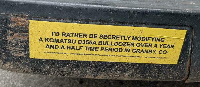 Funny bumper sticker illustrating specific internet comments about modifying a bulldozer in Colorado.