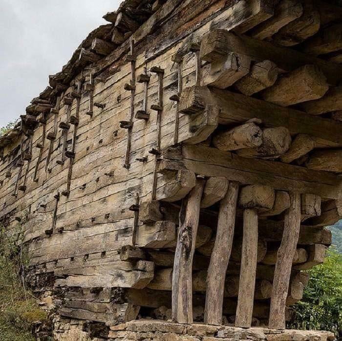 An ancient, complex wooden bridge structure showcasing historic examples of the world’s best infrastructure.