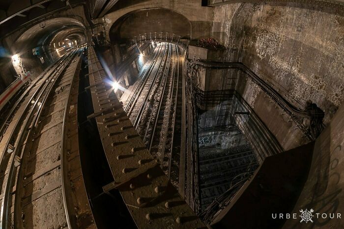 A complex underground transit infrastructure with multi-level subway tracks and tunnels
