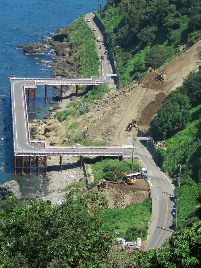 Temporary ocean bridge detour built alongside a landslide, demonstrating the world's best infrastructure