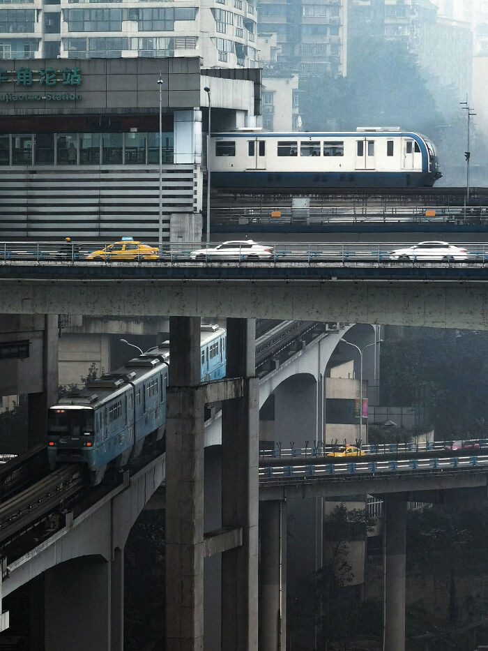 Multilevel transit bridges in an urban area with trains and cars representing complex world infrastructure