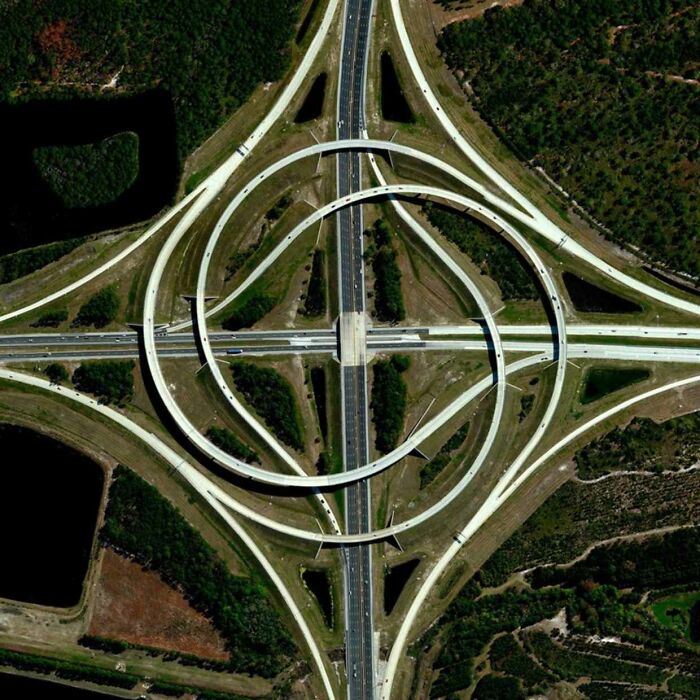 Aerial view of a complex highway interchange, representing world's best infrastructure planning