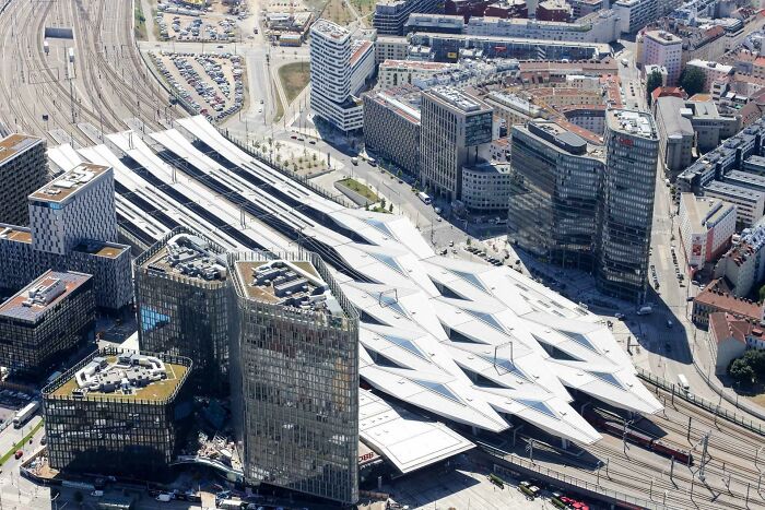 An aerial perspective of a modern, futuristic railway station as part of the world's best infrastructure