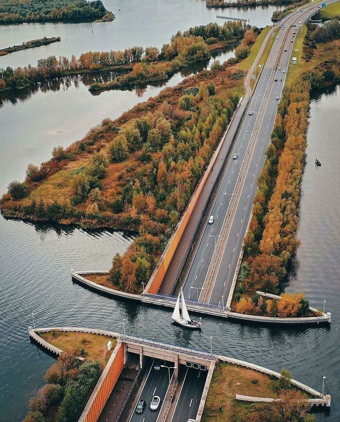 An aerial view of an aqueduct over a highway tunnel, displaying world's best infrastructure design
