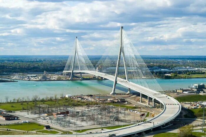 Large cable-stayed suspension bridge spanning a wide waterway, representing modern infrastructure design.