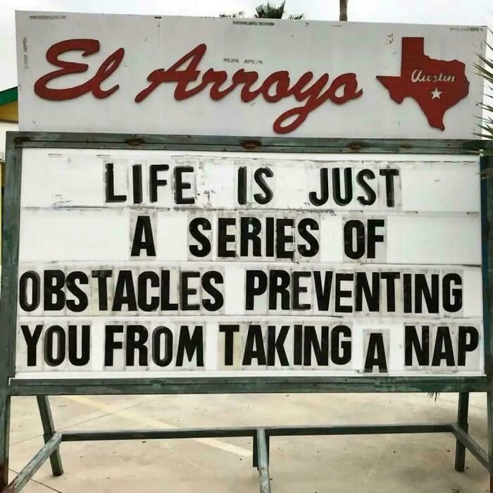 Humorous sign about life obstacles on restaurant board El Arroyo