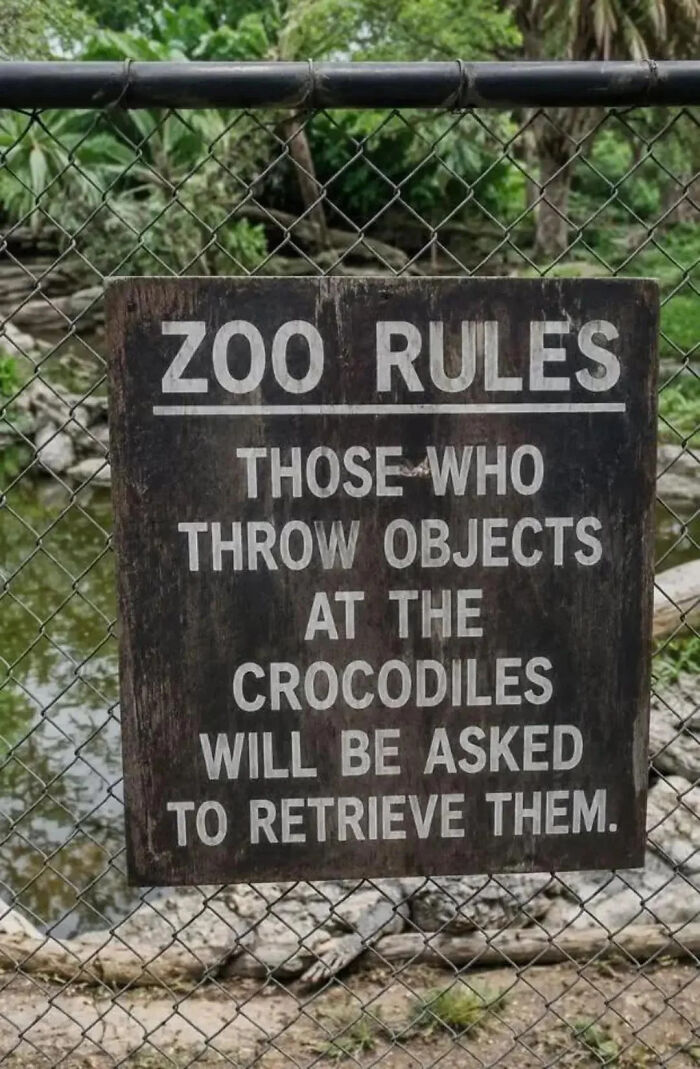 Funny zoo rules sign warning about throwing objects at crocodiles