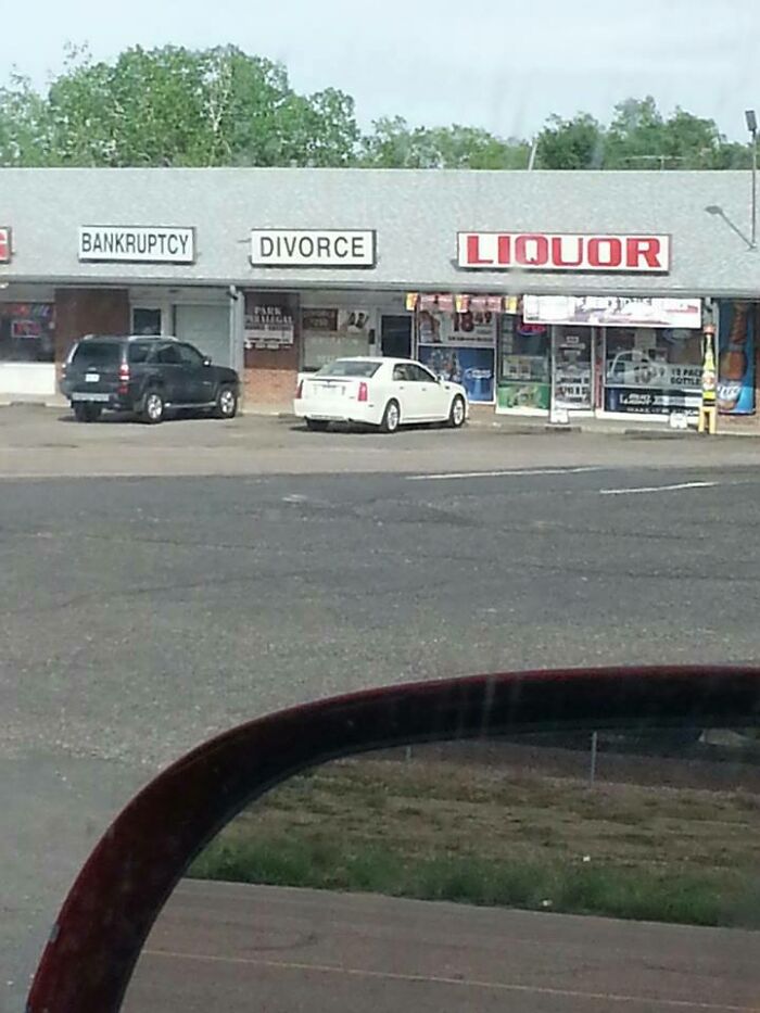 Funny storefront signs labeled bankruptcy, divorce, and liquor