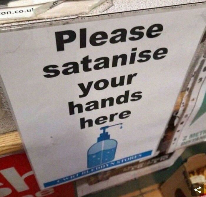 Unhinged sign asking to satanise hands with illustration of hand sanitizer
