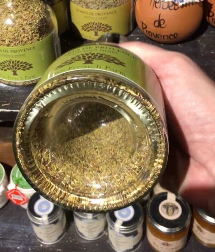 Spice jar with an excessively recessed bottom showcasing terrible product design