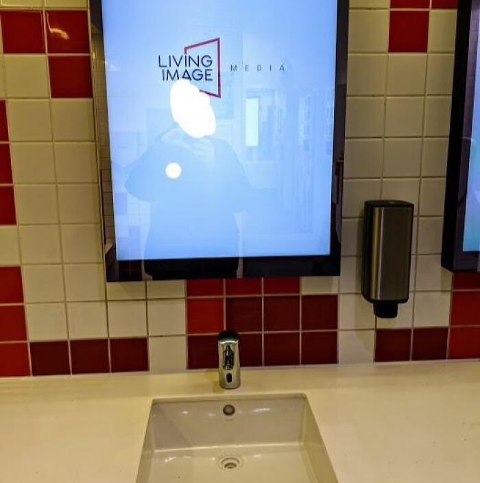 A mirror with a bright screen in the middle, an example of terrible product design