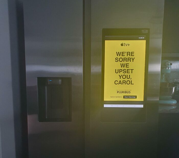 Smart refrigerator screen displaying intrusive advertisement illustrating terrible product design