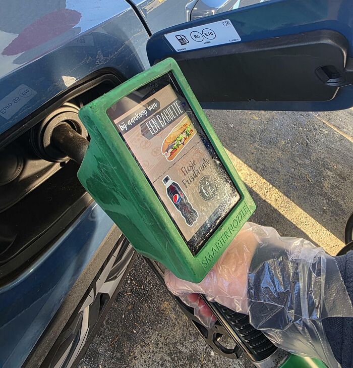 A gas pump with a built-in advertisement displaying terrible product design