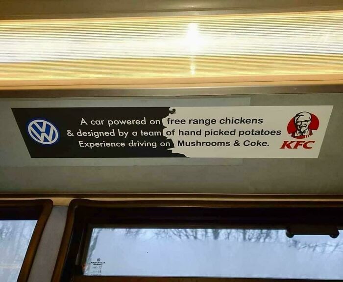 Humorous sign parodying car powered by free range chickens and hand picked potatoes with KFC logo